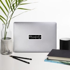 laptop with black sticker #alexafied logo
