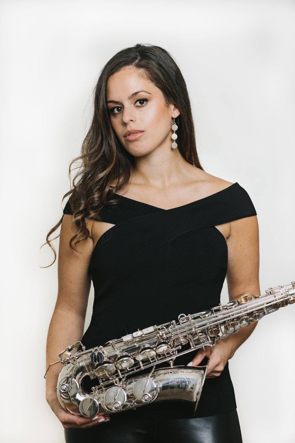 Alexa tarantino looking serious with alto saxophone