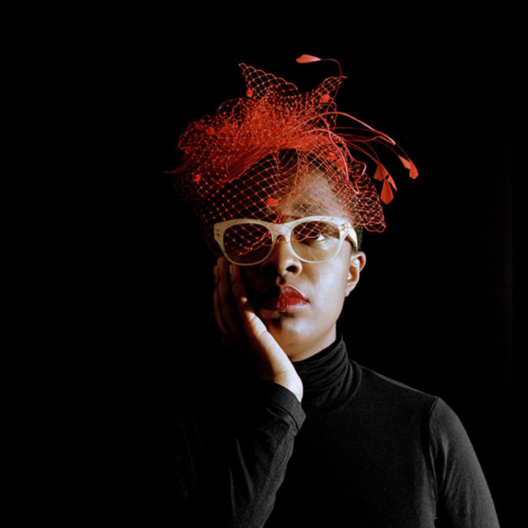 Cecile McLorin Salvant headshot with red hat
